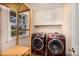 Convenient laundry room featuring storage cabinets and modern washer/dryer at 1135 Banbury Cross, Avondale Estates, GA 30002