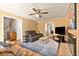 Comfortable living room with fireplace, neutral rug, and seamless flow to other rooms at 1135 Banbury Cross, Avondale Estates, GA 30002