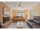 Spacious living room featuring a cozy fireplace, plush seating, and neutral decor at 1135 Banbury Cross, Avondale Estates, GA 30002
