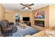 Inviting living room with brick fireplace, plush seating, and ample natural light at 1135 Banbury Cross, Avondale Estates, GA 30002