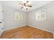 Bedroom featuring hardwood floors, two large windows providing natural light and white walls at 817 N Evelyn Nw, Atlanta, GA 30318