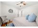 Bedroom with hard wood floors, a ceiling fan, and stylish chair at 817 N Evelyn Nw, Atlanta, GA 30318