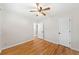 Empty bedroom showcasing hardwood floors, white walls, and two closets with a ceiling fan at 817 N Evelyn Nw, Atlanta, GA 30318