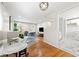 Stylish dining area with hardwood floors, views into living room and a modern chandelier at 817 N Evelyn Nw, Atlanta, GA 30318