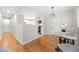 Bright dining area with hardwood floors, modern lighting, and a view into the kitchen at 817 N Evelyn Nw, Atlanta, GA 30318