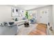 Inviting living area with hardwood floors, cozy seating, and natural light from a large window at 817 N Evelyn Nw, Atlanta, GA 30318