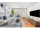 Well-lit living area with hardwood floors, modern decor, and comfortable seating at 817 N Evelyn Nw, Atlanta, GA 30318