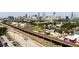 Expansive aerial view of community with nearby rail, city skyline, and green spaces at 170 Boulevard Se # H213, Atlanta, GA 30312