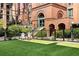 Charming building entrance with arched brick doorway and green space at 170 Boulevard Se # H213, Atlanta, GA 30312