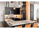 Bright kitchen boasts black cabinetry, stone counters, and stainless appliances at 170 Boulevard Se # H213, Atlanta, GA 30312