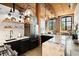 Modern kitchen with exposed brick, stainless appliances, marble counters, and a breakfast bar at 170 Boulevard Se # H213, Atlanta, GA 30312