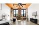 Spacious living room featuring exposed brick walls, wood ceiling beams and large windows at 170 Boulevard Se # H213, Atlanta, GA 30312