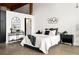 Stylish main bedroom with modern decor, minimalist furniture and concrete floors at 170 Boulevard Se # H213, Atlanta, GA 30312