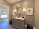 Elegant bathroom with marble vanity, decorative mirror, sconce lighting, and stylish accents at 5210 Timber S Trl, Sandy Springs, GA 30342