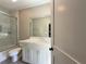 Bathroom featuring a glass enclosed shower and tub combo, and a double sink vanity at 5210 Timber S Trl, Sandy Springs, GA 30342