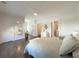 Bright bedroom with hardwood flooring, decorative mirror, and a sitting bench at 5210 Timber S Trl, Sandy Springs, GA 30342
