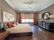 Comfortable bedroom with hardwood floors, lots of natural light, and elegant decor at 5210 Timber S Trl, Sandy Springs, GA 30342
