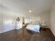Airy bedroom boasts hardwood floors, ceiling fan, and a sitting bench at 5210 Timber S Trl, Sandy Springs, GA 30342