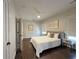 Bright bedroom with hardwood floors, ceiling fan, and neutral decor at 5210 Timber S Trl, Sandy Springs, GA 30342