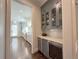 Butler's pantry with wine fridge and upper glass front cabinets at 5210 Timber S Trl, Sandy Springs, GA 30342