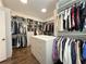 Well-organized walk-in closet with shelving, racks, drawers, and lots of storage space at 5210 Timber S Trl, Sandy Springs, GA 30342