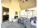 Covered patio with fireplace and comfortable seating, open to the living room at 5210 Timber S Trl, Sandy Springs, GA 30342