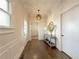 Bright entryway with dark wood floors, modern light fixture, and decorative console table at 5210 Timber S Trl, Sandy Springs, GA 30342