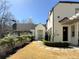 Charming front entrance with lush landscaping and a beautiful white brick facade at 5210 Timber S Trl, Sandy Springs, GA 30342