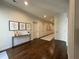 Hallway with decorative vases, artwork, dark wood flooring, and white doors at 5210 Timber S Trl, Sandy Springs, GA 30342