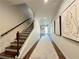 Hallway boasts hardwood floors, staircase, and art at 5210 Timber S Trl, Sandy Springs, GA 30342