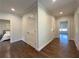 Open hallway with hardwood floors and doors leading to bedrooms and other rooms at 5210 Timber S Trl, Sandy Springs, GA 30342