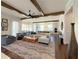 Bright living room with wood beams, open to the kitchen, and stylish decor at 5210 Timber S Trl, Sandy Springs, GA 30342