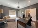 Well-appointed office features a modern desk, chaise lounge, stylish lighting, and neutral color palette at 5210 Timber S Trl, Sandy Springs, GA 30342