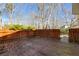 Wooden back deck area, surrounded by a wooden fence at 9760 Greenside Way, Douglasville, GA 30135