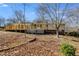 The backyard has a lovely wooden deck, perfect for enjoying the outdoors in the landscaped yard at 9760 Greenside Way, Douglasville, GA 30135