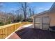 Expansive wooden deck, perfect for outdoor entertaining with wooden railing and space to relax at 9760 Greenside Way, Douglasville, GA 30135