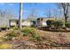 Charming single-story home with stone accents and a well-maintained front yard at 9760 Greenside Way, Douglasville, GA 30135