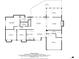 Floorplan featuring primary bedroom, living room, dining area, kitchen, garage, sunroom, and deck at 9760 Greenside Way, Douglasville, GA 30135