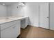 Bathroom featuring double sink vanity, framed mirror and wood-look flooring at 27 Crescent Chase, Dallas, GA 30157