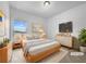 Serene main bedroom with a plush bed, a dresser, and a large window at 27 Crescent Chase, Dallas, GA 30157