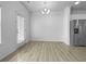 Dining area featuring sleek flooring and stainless steel appliances at 27 Crescent Chase, Dallas, GA 30157