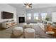 Bright living room with fireplace, ample natural light, modern furniture, and stylish decor at 27 Crescent Chase, Dallas, GA 30157