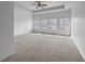 Spacious main bedroom with tray ceilings, carpet flooring, and abundant natural light at 27 Crescent Chase, Dallas, GA 30157