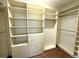 Custom walk-in closet with built in shelving and drawers for optimal storage at 317 Glens Way, Woodstock, GA 30188