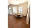 Elegant dining room with natural light, chandelier and seating for six at 317 Glens Way, Woodstock, GA 30188