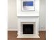 Living room fireplace with beautiful white mantle and stone at 317 Glens Way, Woodstock, GA 30188