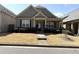 Charming one-story home featuring a manicured front yard and welcoming entrance at 317 Glens Way, Woodstock, GA 30188