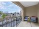 Relax on this balcony with cozy seating and an open view of the neighborhood below at 395 Pharr Ne Rd # 305, Atlanta, GA 30305