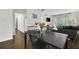 Contemporary dining area with a dark wood table and a view of the living room and balcony at 395 Pharr Ne Rd # 305, Atlanta, GA 30305