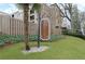 A decorative sign marks the entrance to Barcelona Condominiums, surrounded by lush landscaping and mature trees at 395 Pharr Ne Rd # 305, Atlanta, GA 30305